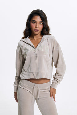 Displays a model wearing the String 'Juicy' branded Old Gothic Oversized Cropped Hoodie