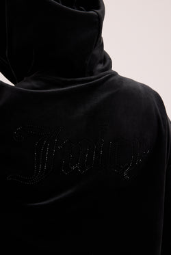 Displays a model wearing the Black outline 'Juicy' branded diamanté oversized cropped hoodie 