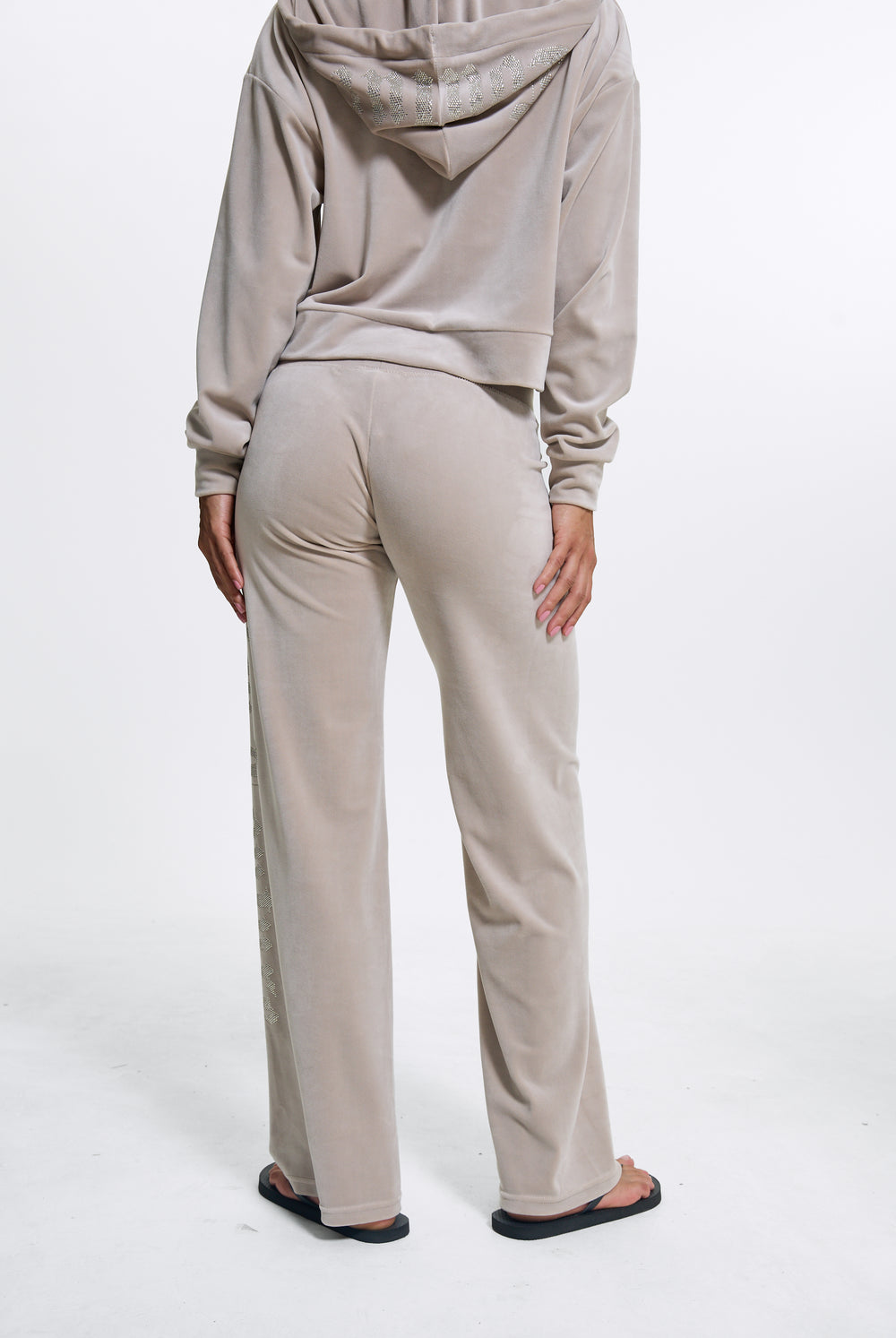 Displays a model wearing the String 'Juicy' branded Old Gothic Diamante Og Straight Leg Trackpant
