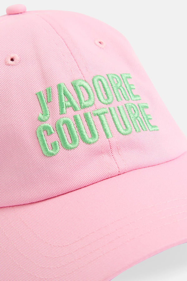 Displays the Begona Pink 'Juicy' branded J'ADORE COUTURE cap featuring the branding 