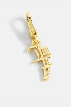 Displays the Gold 'Juicy' branded drop charm 