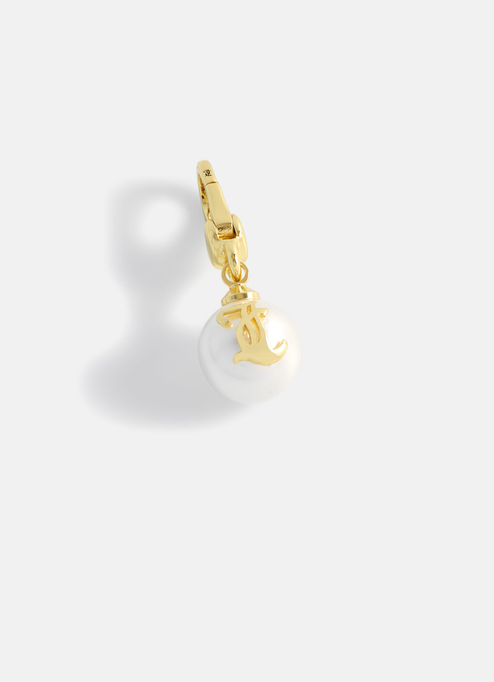 Displays the Gold 'Juicy' branded JC Pearl Charm
