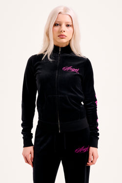 Displays a model wearing the Black 'Juicy' branded angel cotton velour track top