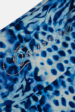 Displays the blue leopard print 'Juicy' branded jersey roll down mini skirt featuring the juicy branding 