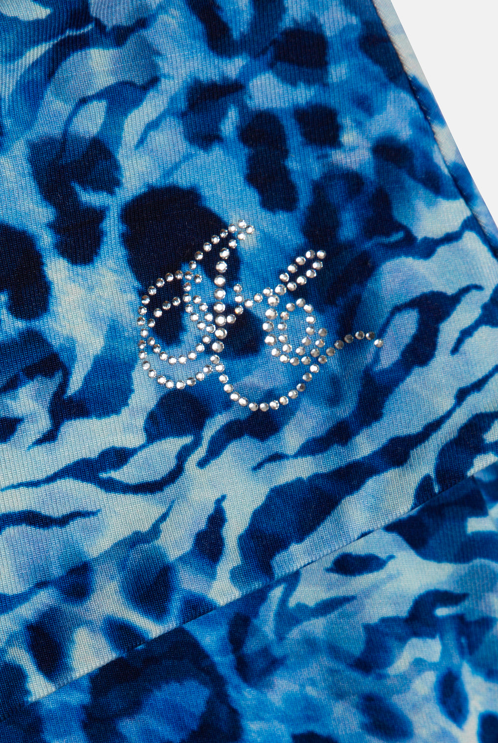 Displays the blue leopard print 'Juicy' branded jersey roll down mini skirt featuring the Juicy Couture logo