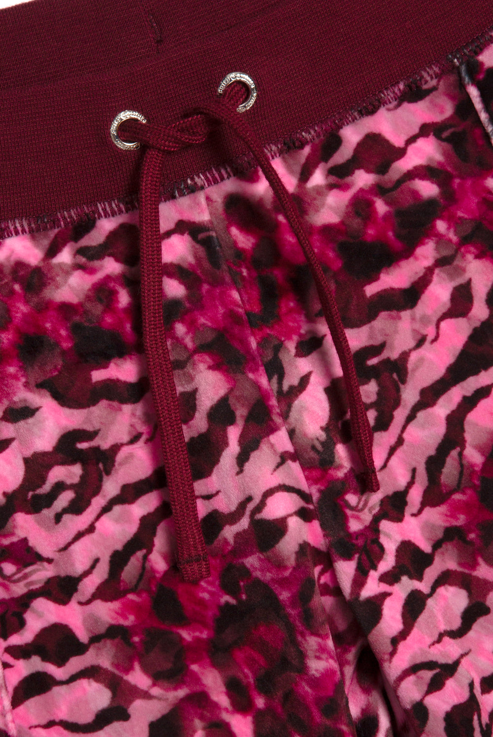 Displays the pink leopard 'Juicy' branded cheetah track bottoms 