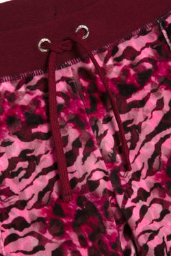 Displays the pink leopard 'Juicy' branded cheetah track bottoms 