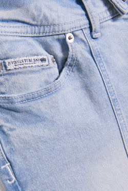 Displays the Light wash 'juicy' branded low rise flared embodied jeans 