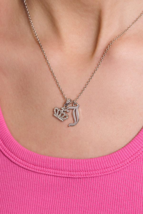 Displays a model wearing the Silver Tone 'Juicy' branded crystal motif crown and J Charm pendant 