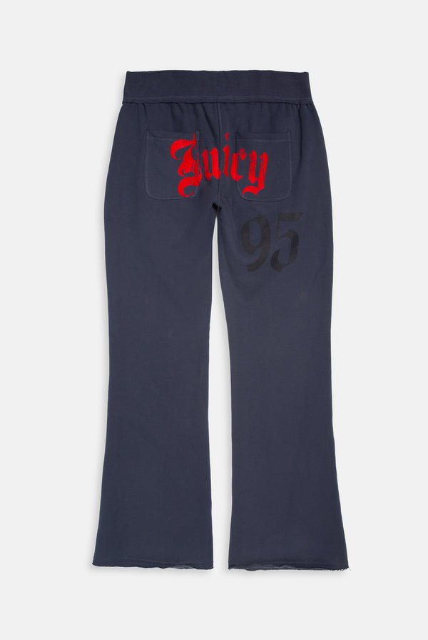 Displays the Mood indigo relaxed fit 'juicy' branded flare fleece track pant 