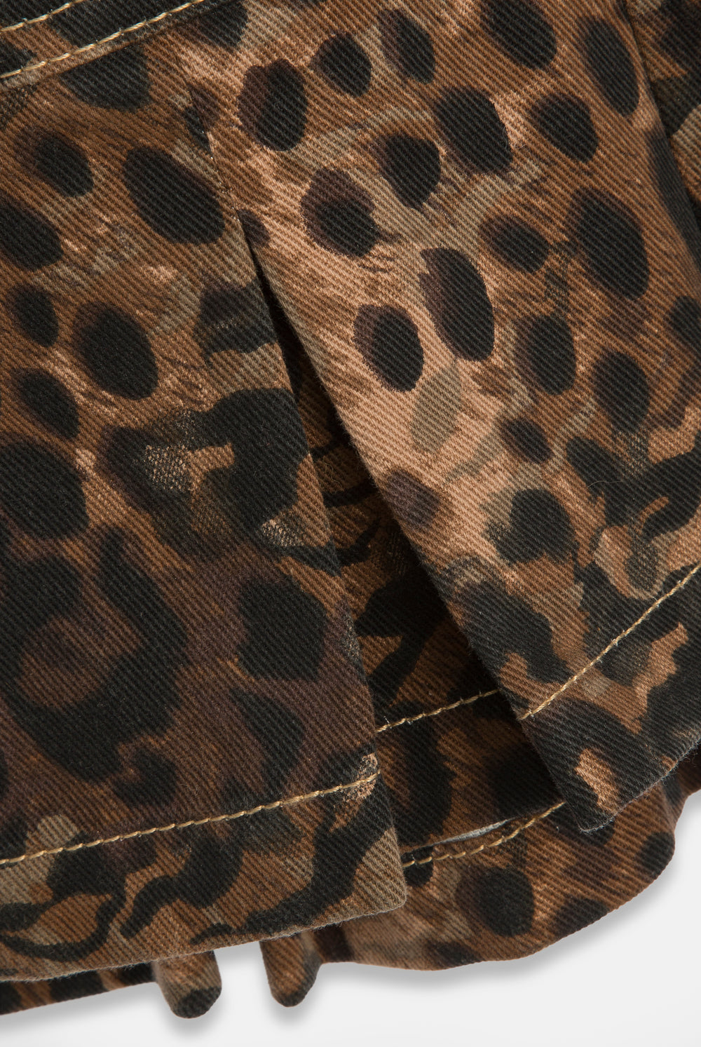 Displays the Animal 'Juicy' branded denim bandeau mini dress featuring the close up on the details 