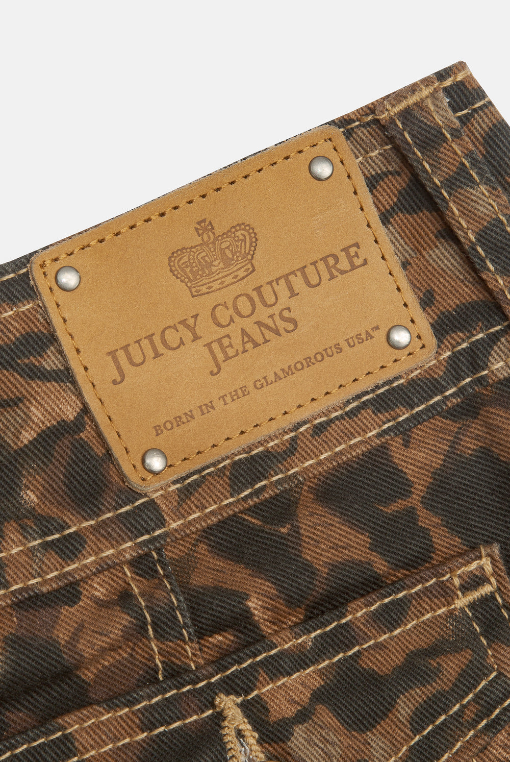 Displays the Animal 'Juicy' branded low rise flared jeans featuring the juicy couture jeans branding 