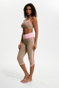 Displays a model wearing the Fungi 'Juicy' branded Sport Contrast Capris