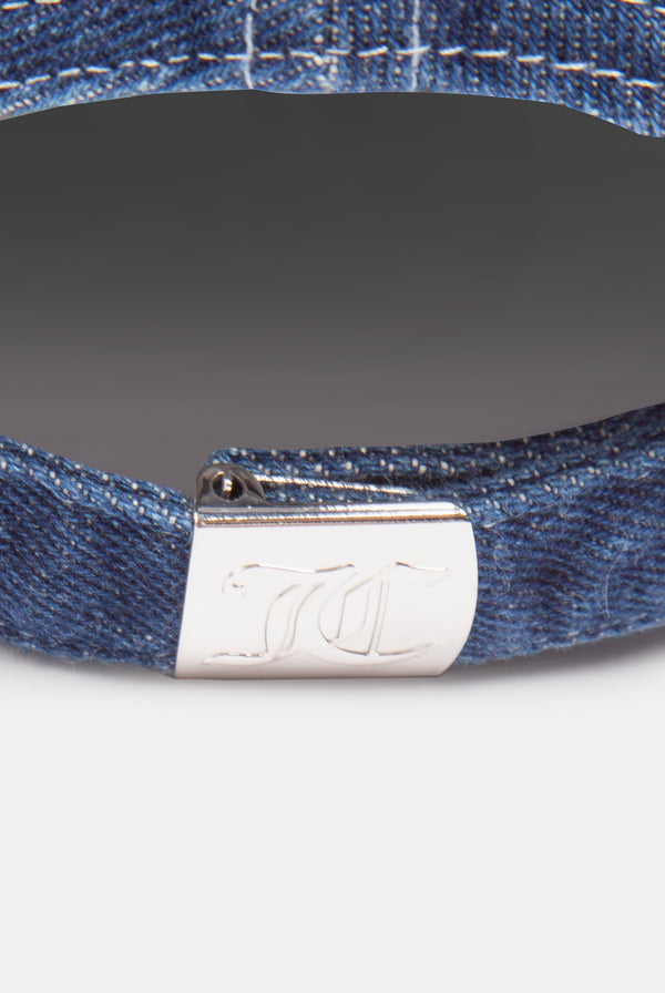 Displays the 'Juicy' branded Bleach wash denim cap featuring the juicy branding 