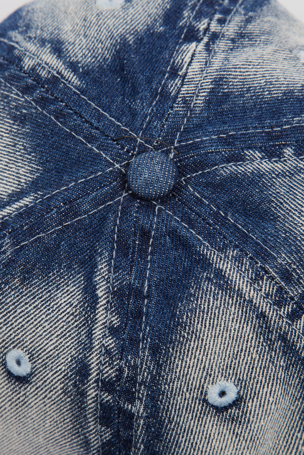Displays the 'Juicy' branded Bleach wash denim cap 