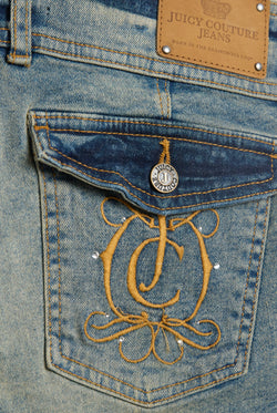 Displays the Vintage Wash 'juicy' branded JC Crest booty denim shorts featuring the juicy Couture logo 