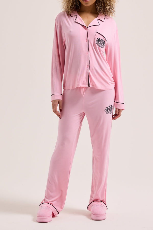 Displays a model wearing the Juicy Pink 'juicy' branded dog crest pyjama set 
