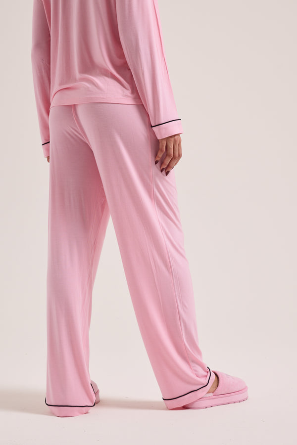 Displays a model wearing the Juicy Pink 'juicy' branded dog crest pyjama set 