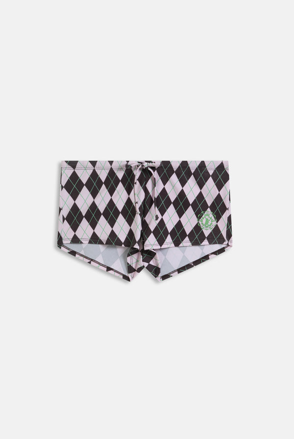 Displays a model wearing the Java 'Juicy' shorts included in the pyjama set 