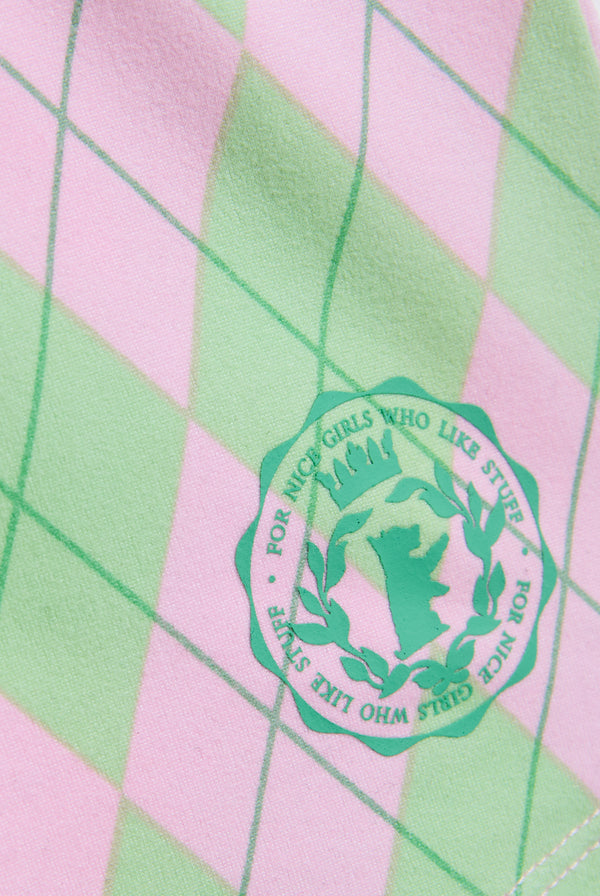 Displays a model wearing the Juicy Pink 'Juicy' short included in the pyjama set featuring the juicy logo