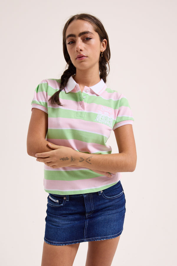 Displays a model wearing the green pink stripe 'Juicy' branded puff sleeve polo top 