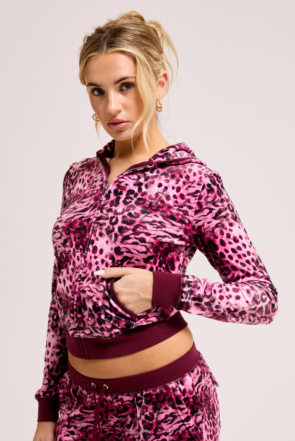 Displays a model wearing the Pink Leopard Print 'Juicy' branded Zip through hoodie 