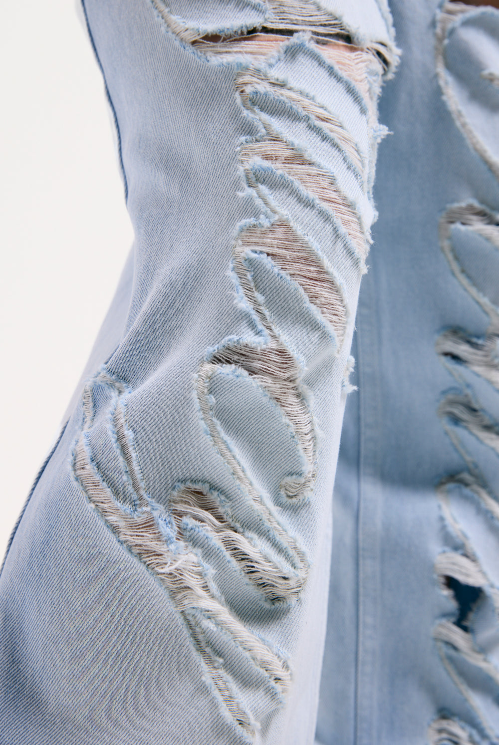 Displays the Bleached 'Juicy' branded denim distressed wide leg jeans featuring the juicy branding 