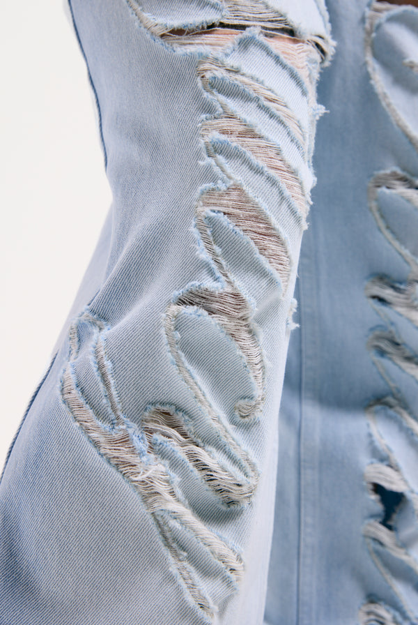 Displays the Bleached 'Juicy' branded denim distressed wide leg jeans featuring the juicy branding 