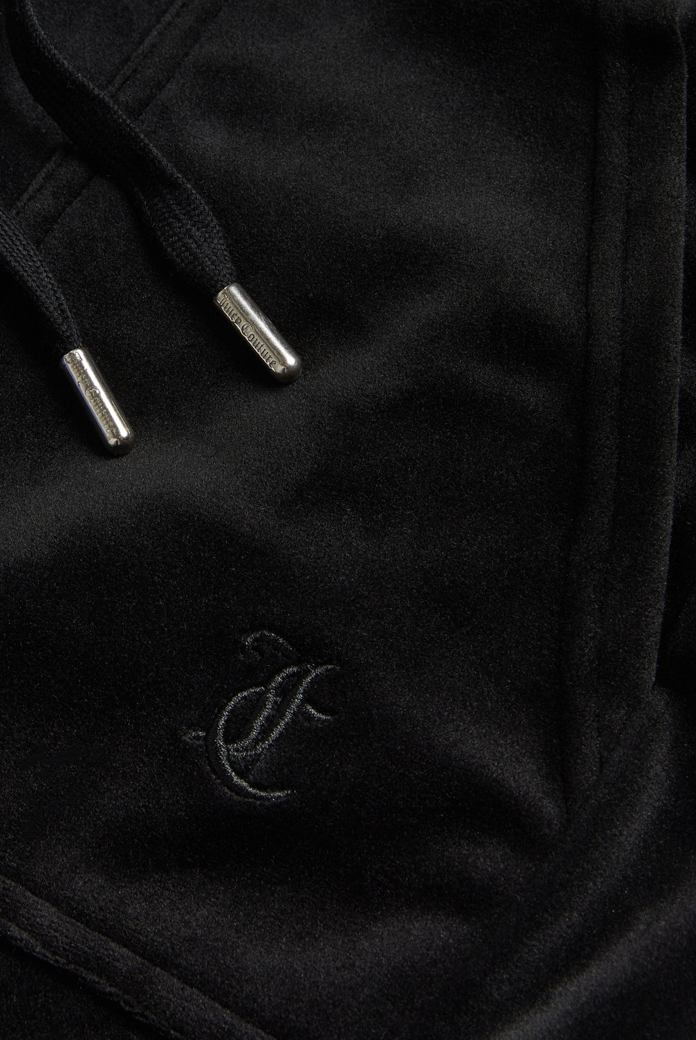 Displays the Black Low rise flare pocket 'Juicy' branded classic velour track pant featuring the Juicy Logo