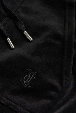 Displays the Black Low rise flare pocket 'Juicy' branded classic velour track pant featuring the Juicy Logo