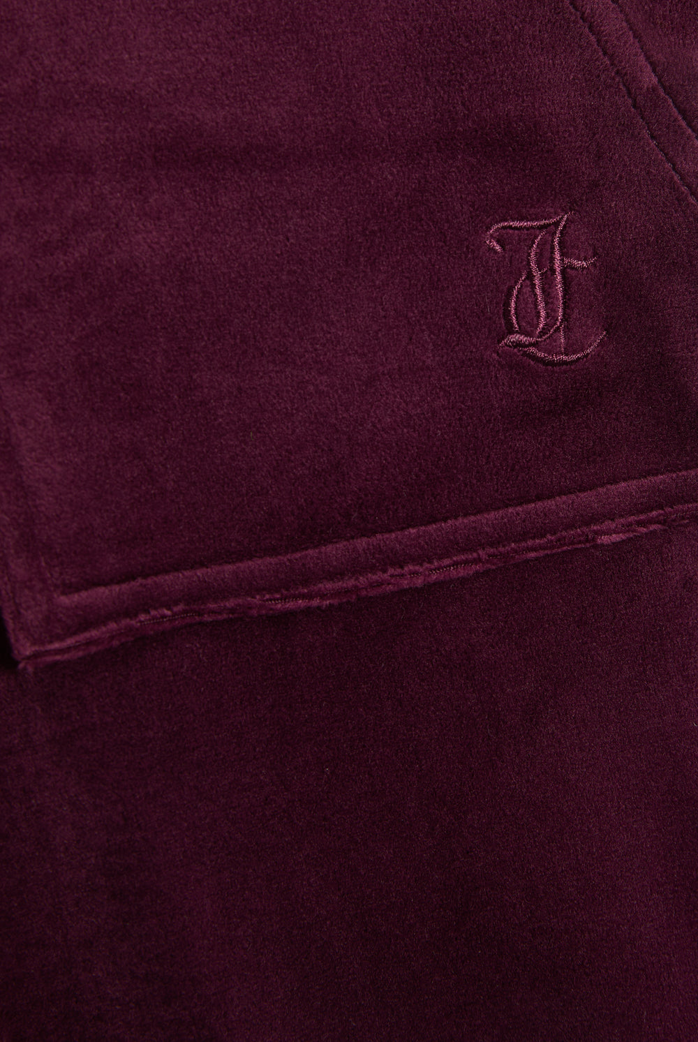 Displays the Winetasting & Gold 'Juicy' branded Low Rise Flare Classic Velour Track Pant featuring the juicy couture logo branding