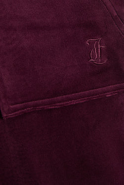 Displays the Winetasting & Gold 'Juicy' branded Low Rise Flare Classic Velour Track Pant featuring the juicy couture logo branding