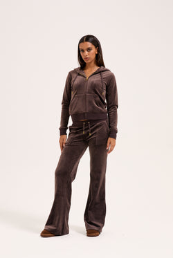 Displays the model wearing the Java & Gold 'Juicy' branded classic velour Robertson hoodie 