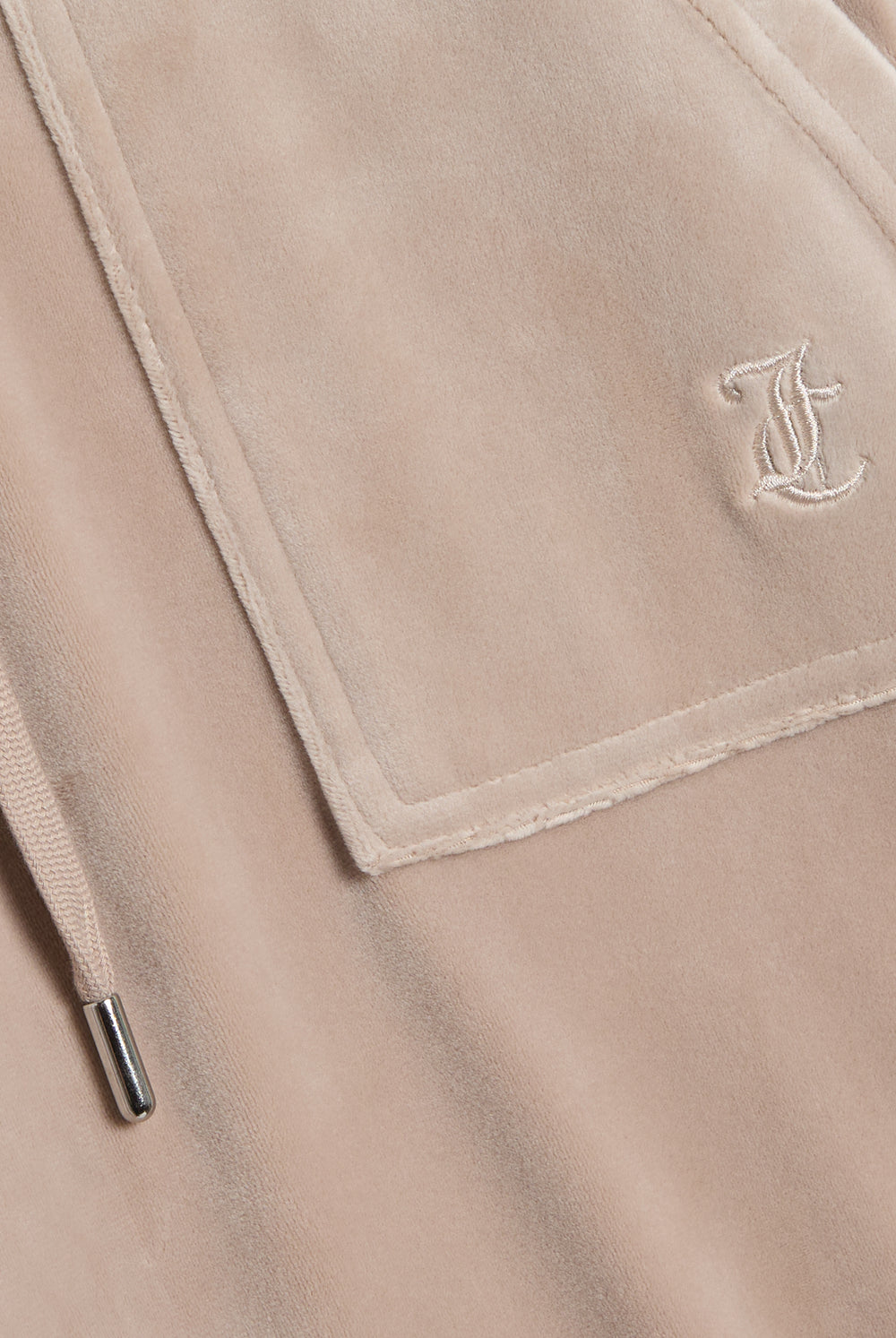 Displays the String 'Juicy' branded low rise flare pocket classic velour track pant featuring the juicy branding 