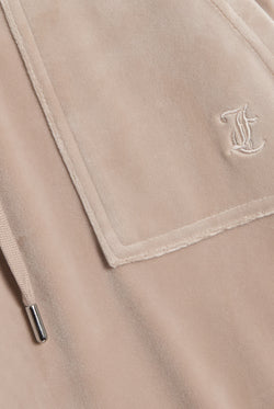 Displays the String 'Juicy' branded low rise flare pocket classic velour track pant featuring the juicy branding 