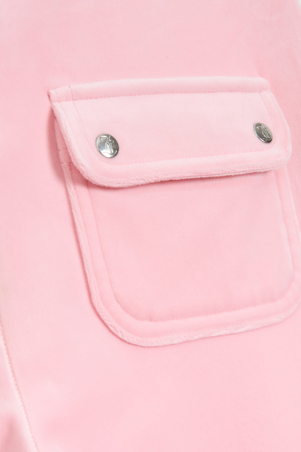 Displays the Juicy Pink 'Juicy' branded low rise flare classic velour track pant featuring a pocket