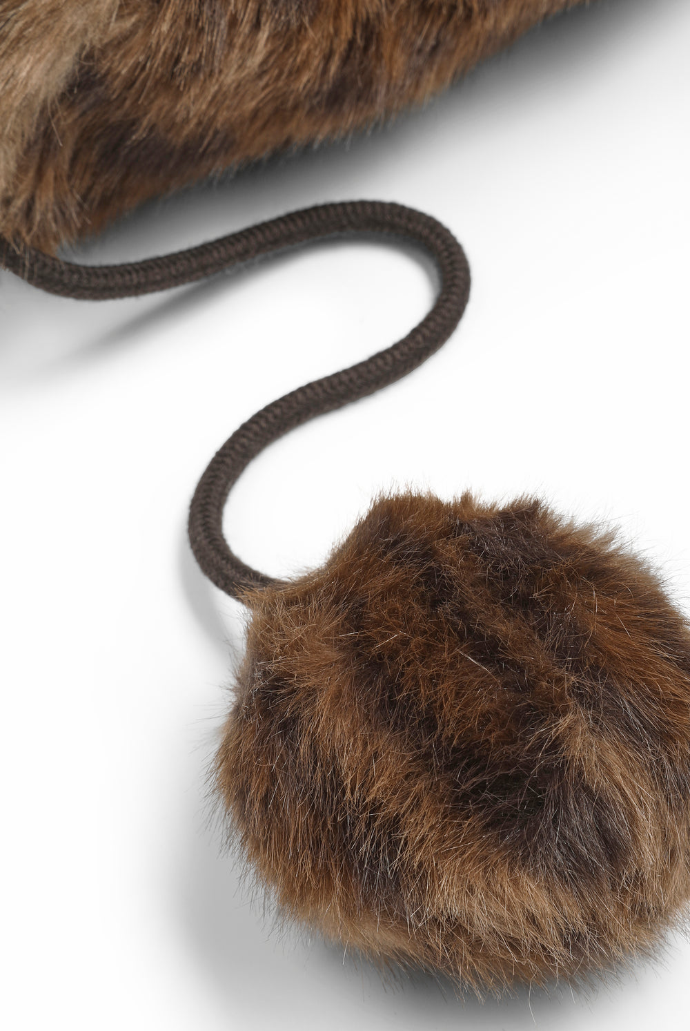 Displays the Natural Leopard 'Juicy' branded Long Pile Fur Trapper featuring close up on the details