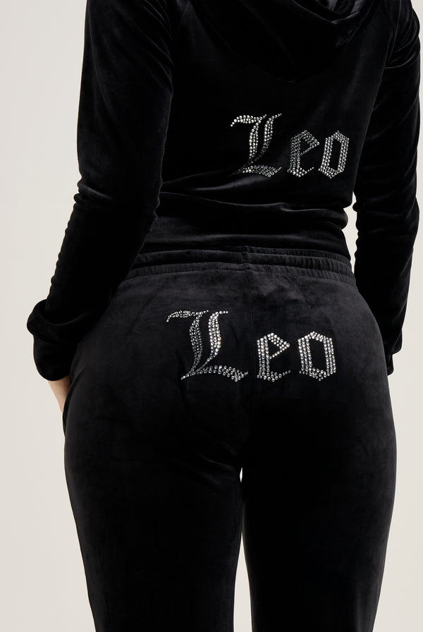 Displays the Black 'Juicy' branded 'LEO' Diamanté velour zip through hoodie featuring the Leo branding