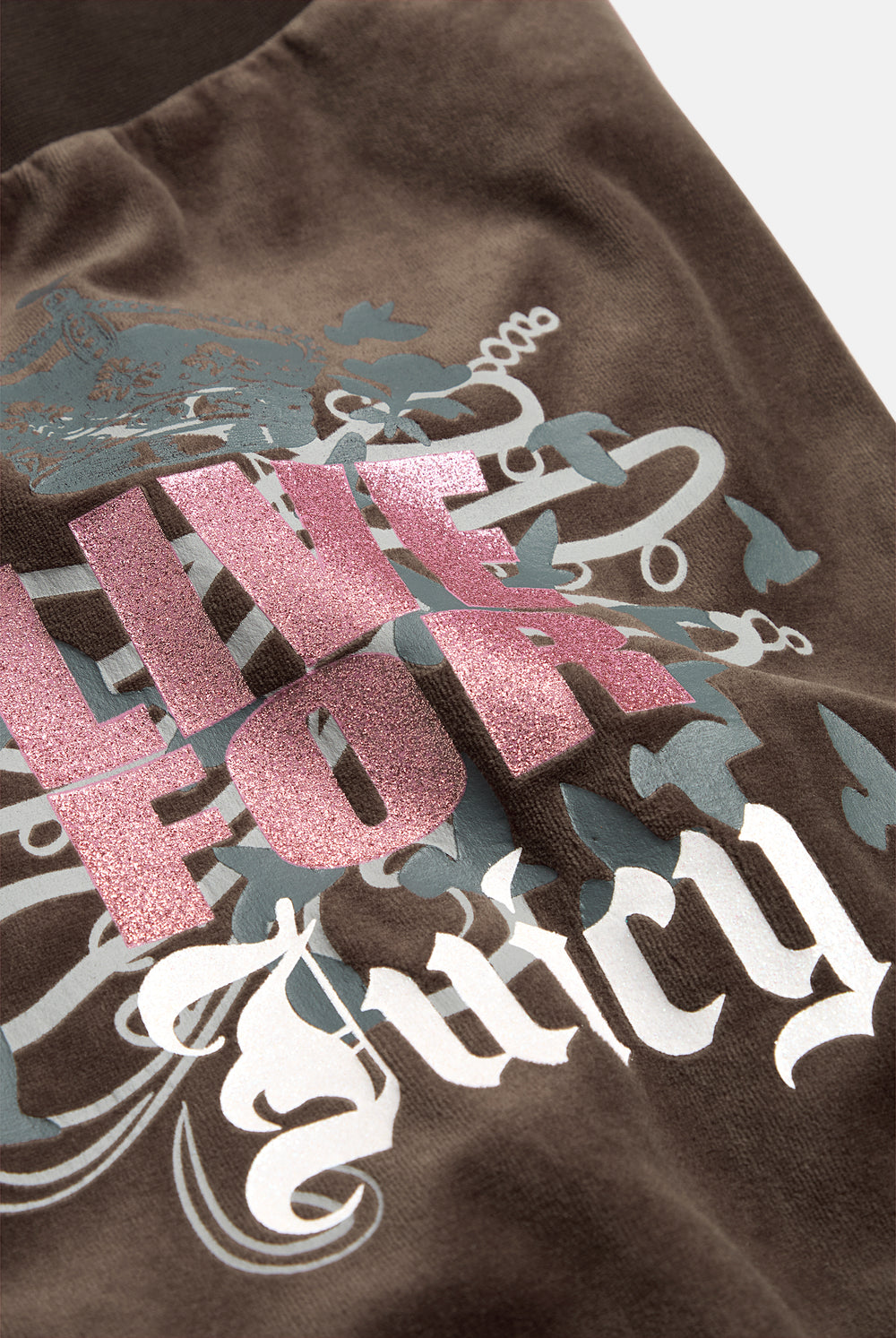 Displays the Java 'Juicy' branded Live For Juicy Og Straight Trackpants featuring the details on the juicy branding 