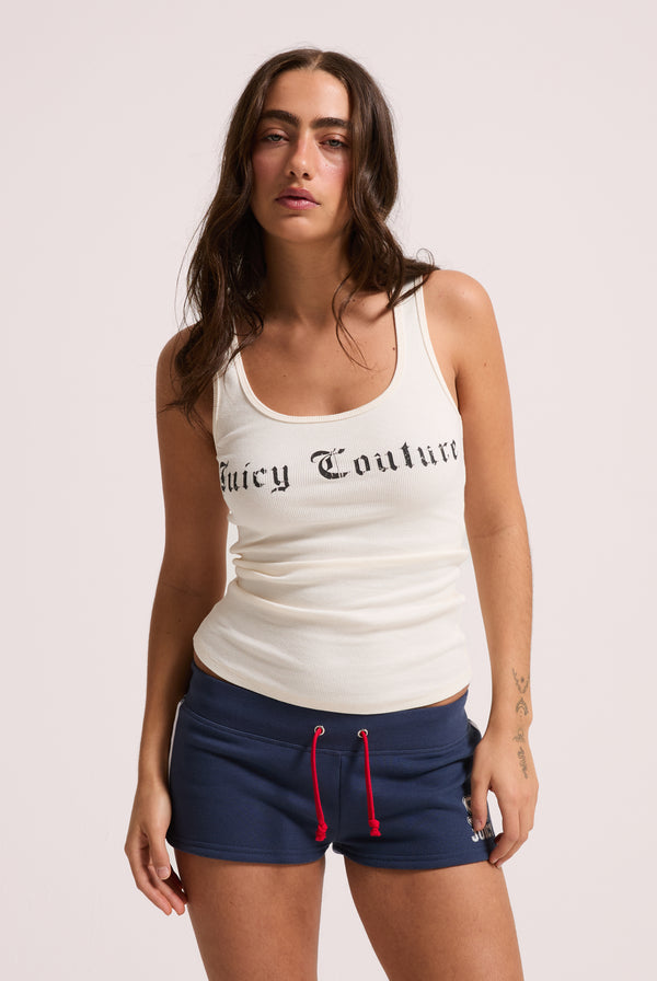 Displays a model wearing the White 'Juicy' branded longline ribbed vest 