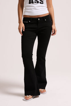 Displays a model wearing the Black stretch 'Juicy' branded twill low rise flare jeans 