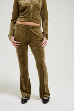 Displays a model wearing  the Dark Olive 'Juicy' branded velour diamanté tracksuit bottom