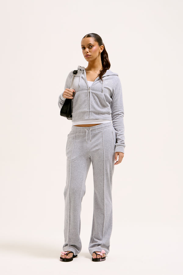 Displays a model wearing the Silver Marl Diamanté 'Juicy' branded cotton velour zip-through hoodie