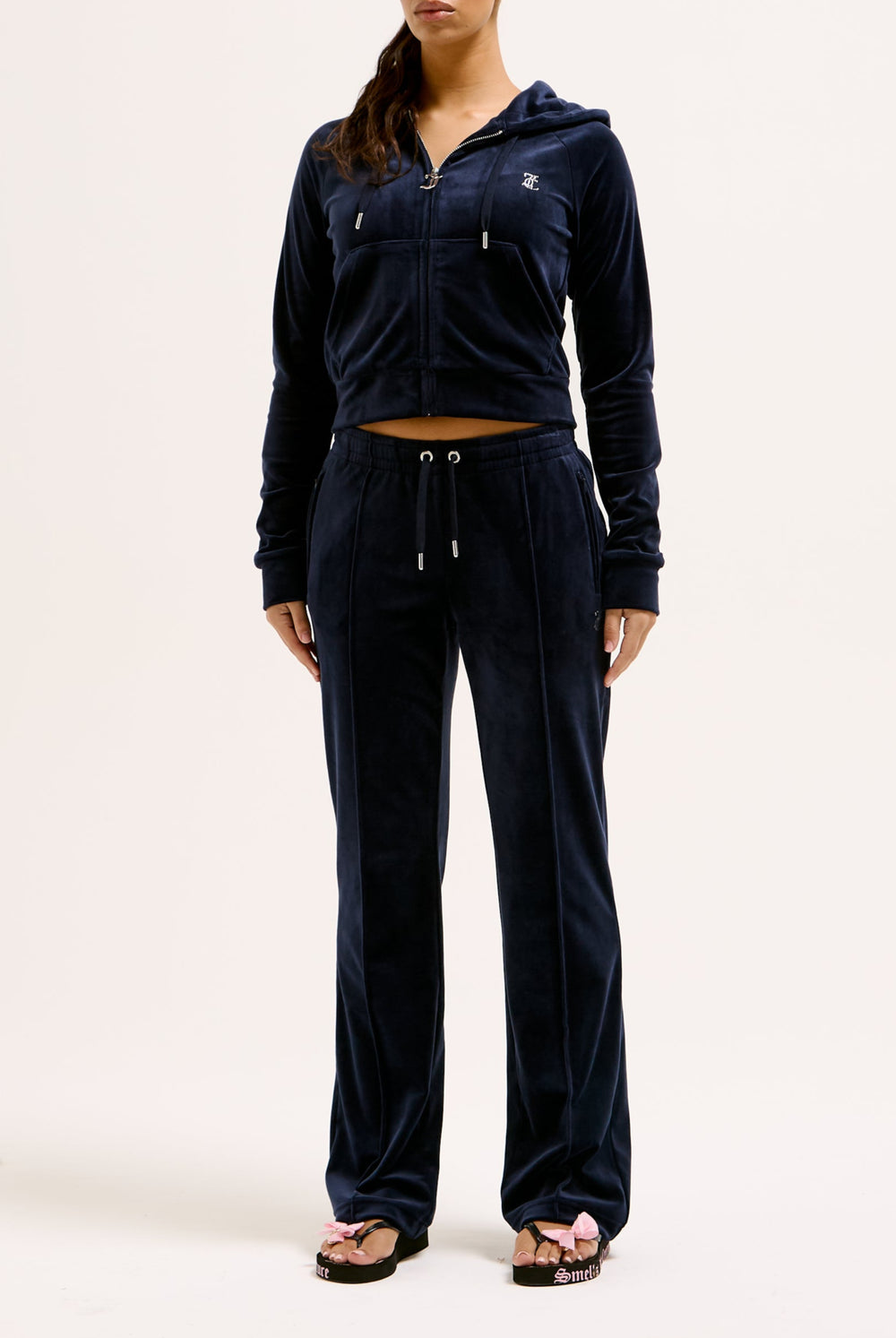 Displays a model wearing the Night Sky 'juicy' branded velour diamanté tracksuit bottom