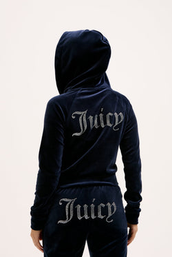 Displays a model wearing the Night Sky 'juicy' branded velour diamanté tracksuit bottom