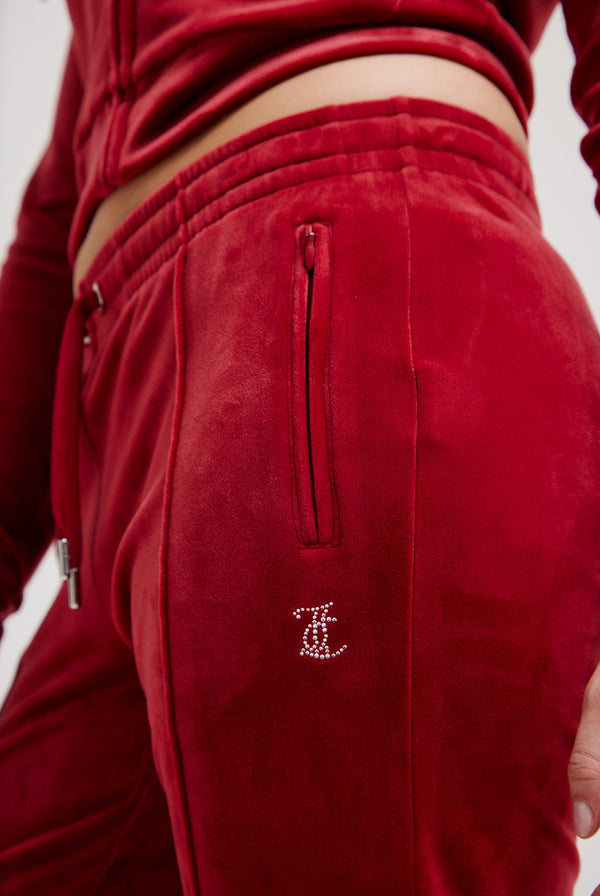 Displays the Red Dahlia 'Juicy' branded velour diamanté tracksuit bottom