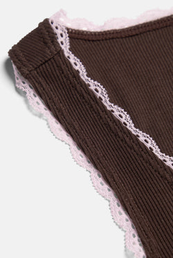 Displays the Java 'Juicy' branded Lace Trim Vest featuring the close up on the details 