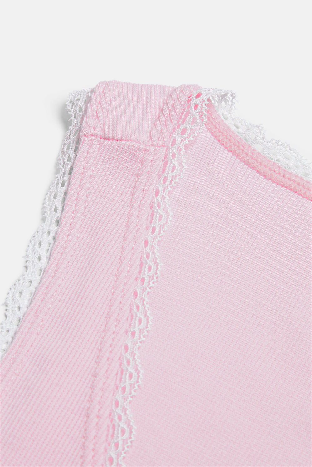 Displays the Cherry Blossom 'Juicy' branded Lace Trim Vest featuring the close up on the details 