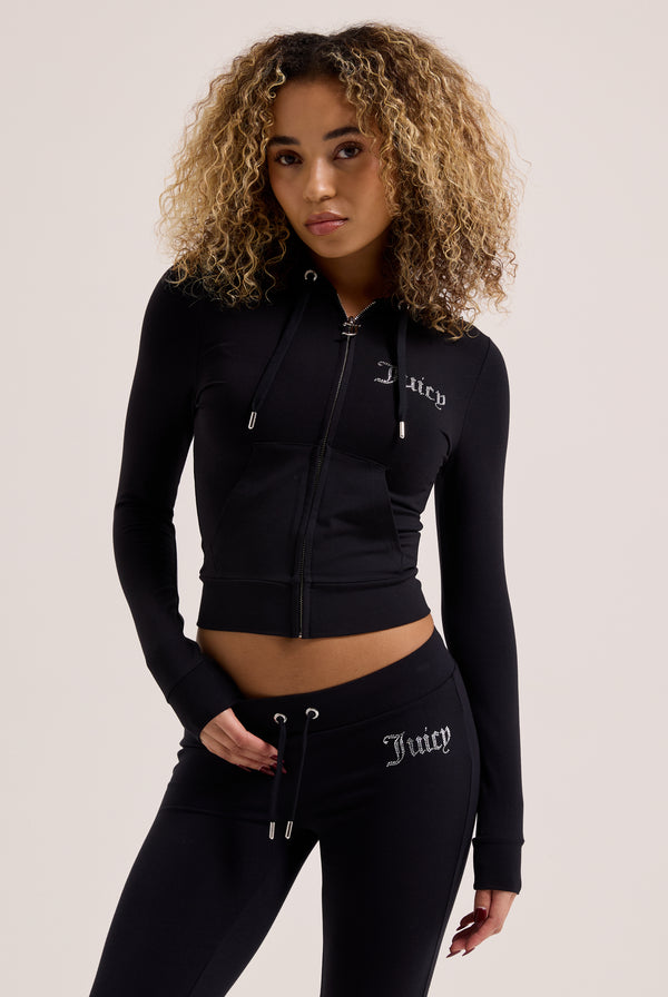 Displays a model wearing the Black 'Juicy' branded diamanté luxury jersey zip-through hoodie
