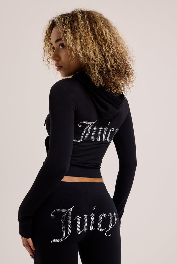 Displays a model wearing the Black 'Juicy' branded diamanté luxury jersey zip-through hoodie